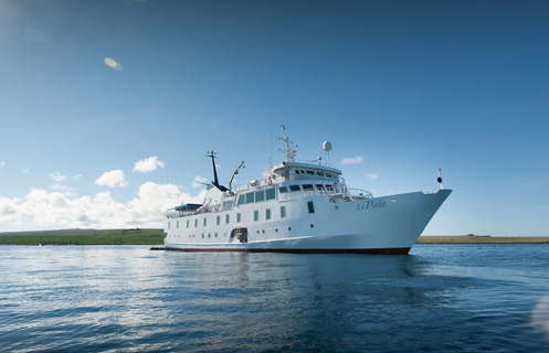 Galapagos Luxury Cruises / adventure with Columbus Travel / luxury Galapagos cruises: exclusive yachts, catamarans, and cruise ships / Galapagos Islands / coast of Ecuador / luxurious accommodations / luxury packages / private yacht charters to eco-friendly catamaran cruises, Columbus Travel / Your Galapagos adventure begins here.